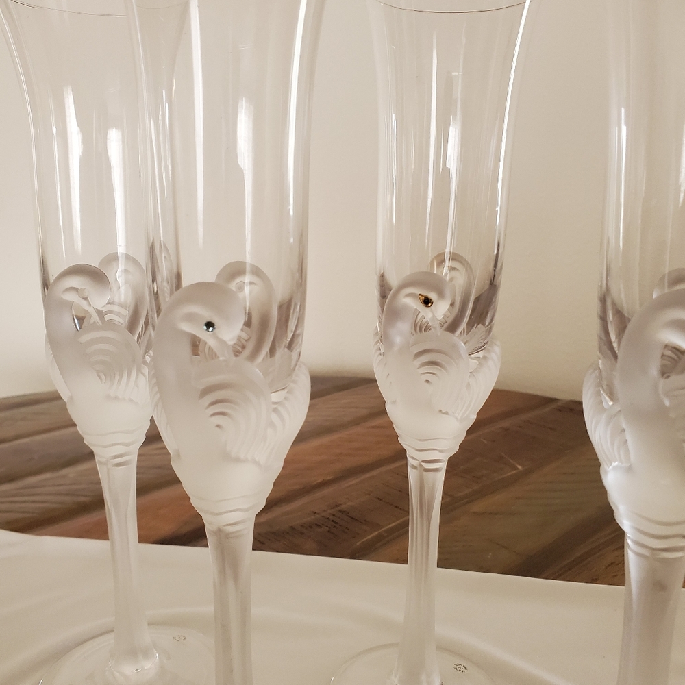 Set of 5 crystal swan champagne flutes.